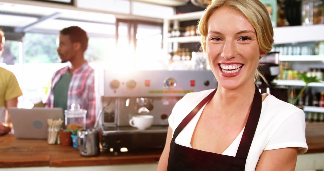 Cheerful Barista Enjoying Work at Coffee Shop Counter - Free Images, Stock Photos and Pictures on Pikwizard.com