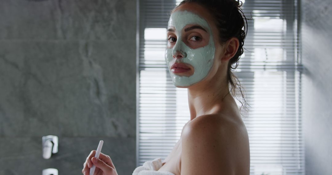 Woman Enjoying Skincare Routine with Face Mask