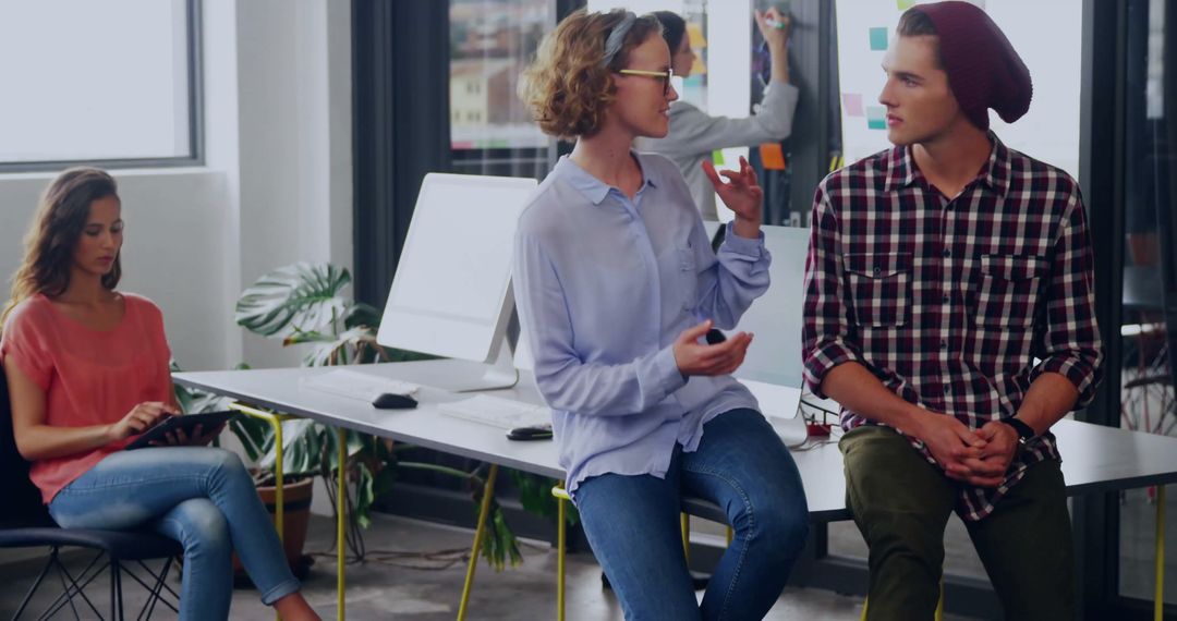 Creative Colleagues Sharing Ideas in Modern Office