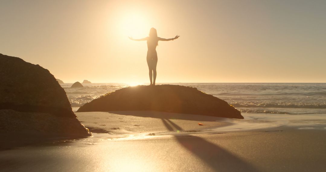 Person Enjoying Sunrise on a Beach Dune, Embracing the Morning Light - Free Images, Stock Photos and Pictures on Pikwizard.com