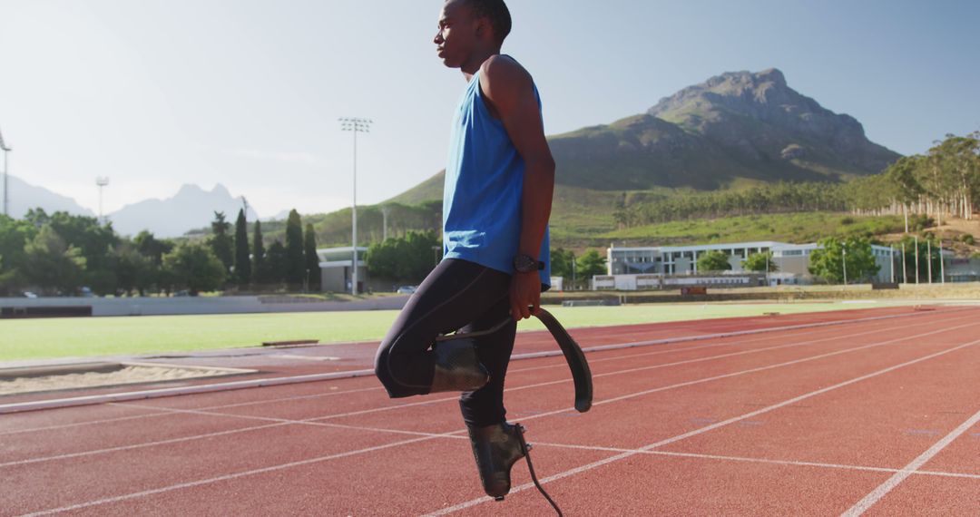 Determined african american male athlete with prosthetic legs training at empty stadium - Free Images, Stock Photos and Pictures on Pikwizard.com