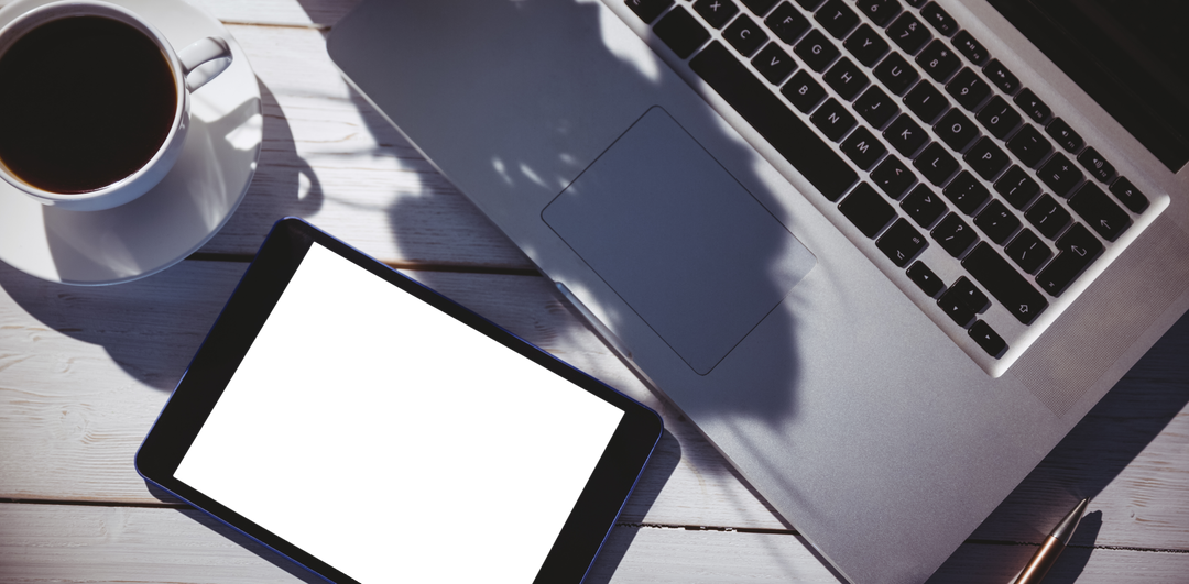 Transparent Laptop and Tablet on Wooden Desk Amidst Soft Light - Download Free Stock Images Pikwizard.com