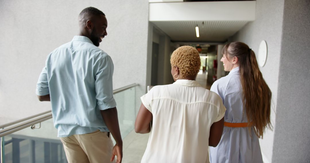 Diverse Business Team Discussing in Modern Office Hallway
