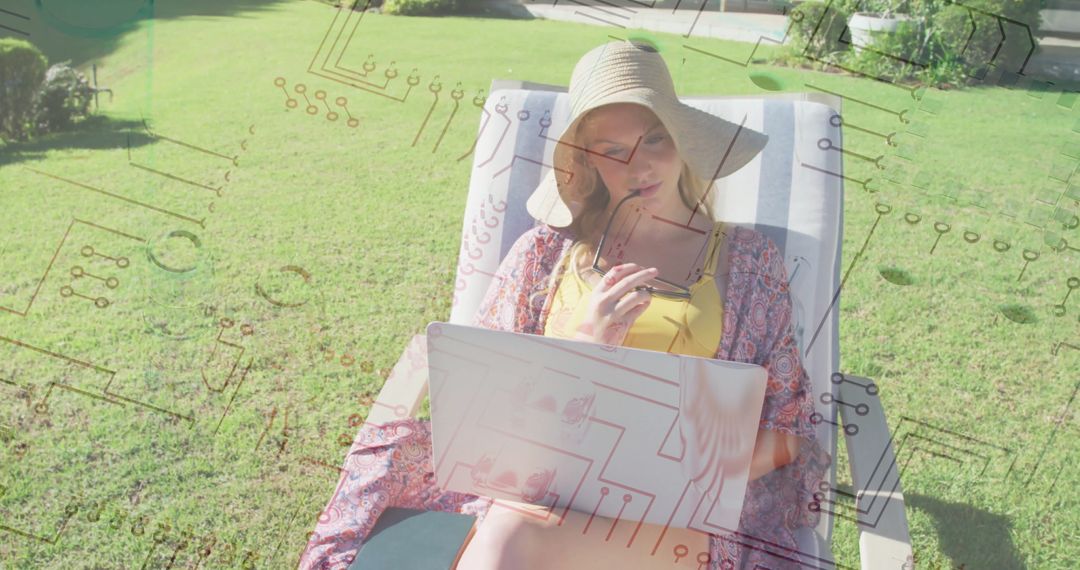 Woman Relaxing Outdoors Using Laptop with Circuit Overlay Technology