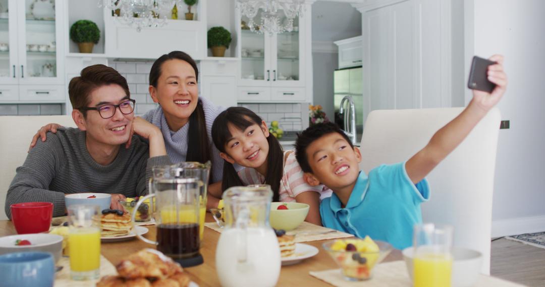 Family Enjoying Breakfast Together, Taking Selfie at Dining Table - Free Images, Stock Photos and Pictures on Pikwizard.com