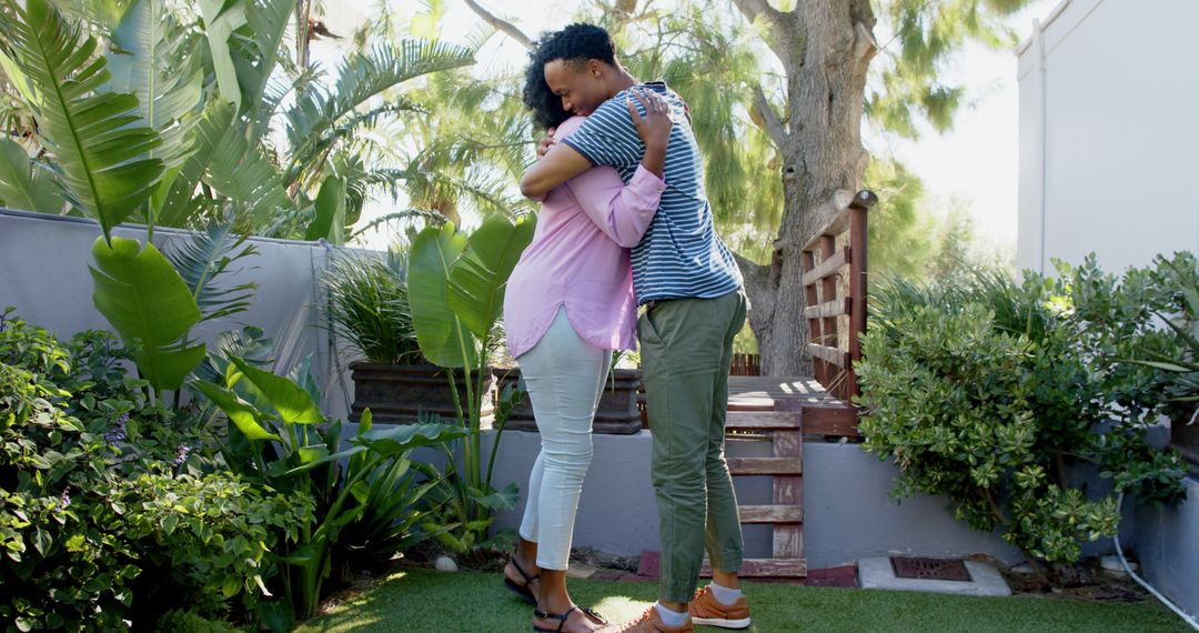 Joyful Proposal in a Garden Setting