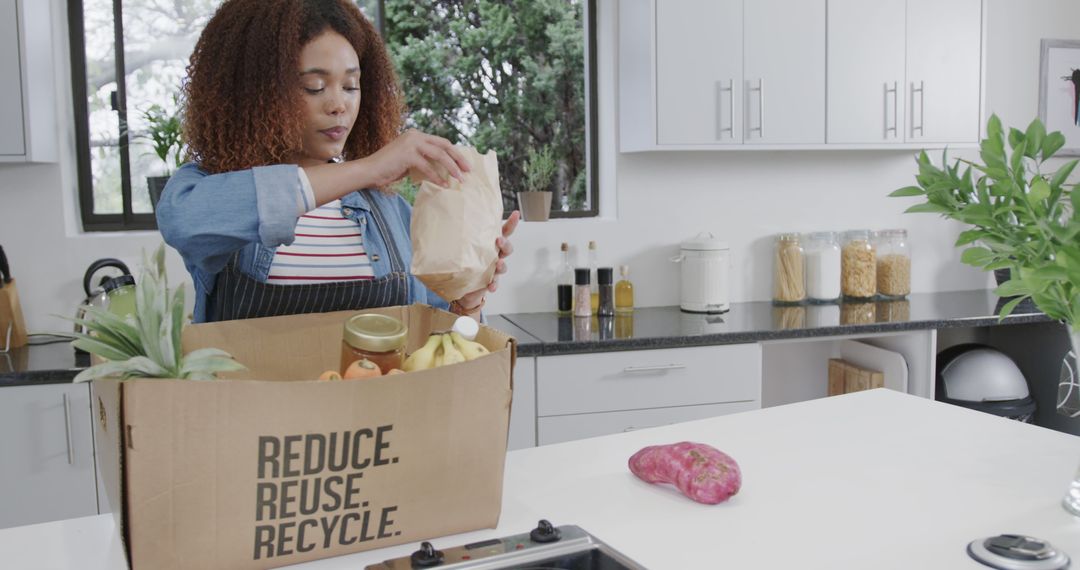 Woman Unpacking Groceries in Modern Kitchen Promoting Sustainable Living - Free Images, Stock Photos and Pictures on Pikwizard.com