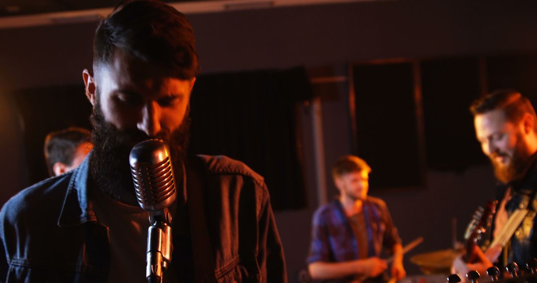 Indie Band Performing Energetically in Recording Studio