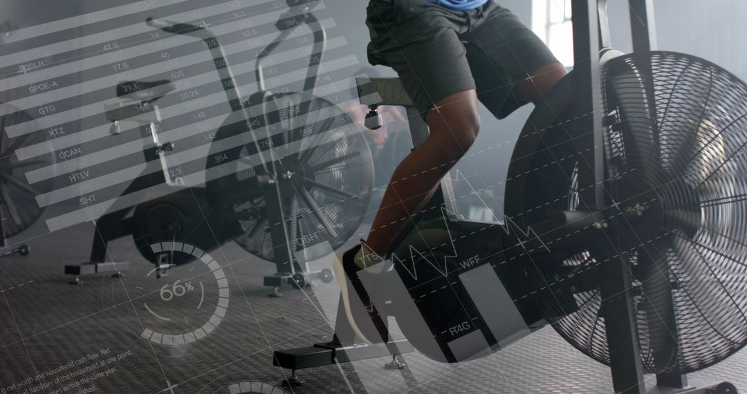 Man Training on Elliptical with Fitness Data Interface