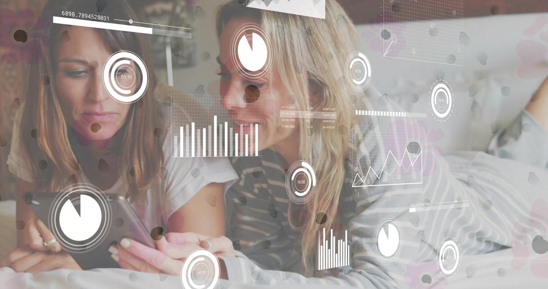 Two Women Relaxing Bed Utilizing Smartphone with Modern Data Interface