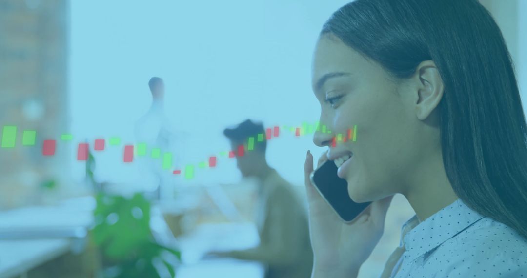 Hispanic Woman Discussing Business with Smartphone in Modern Open Office