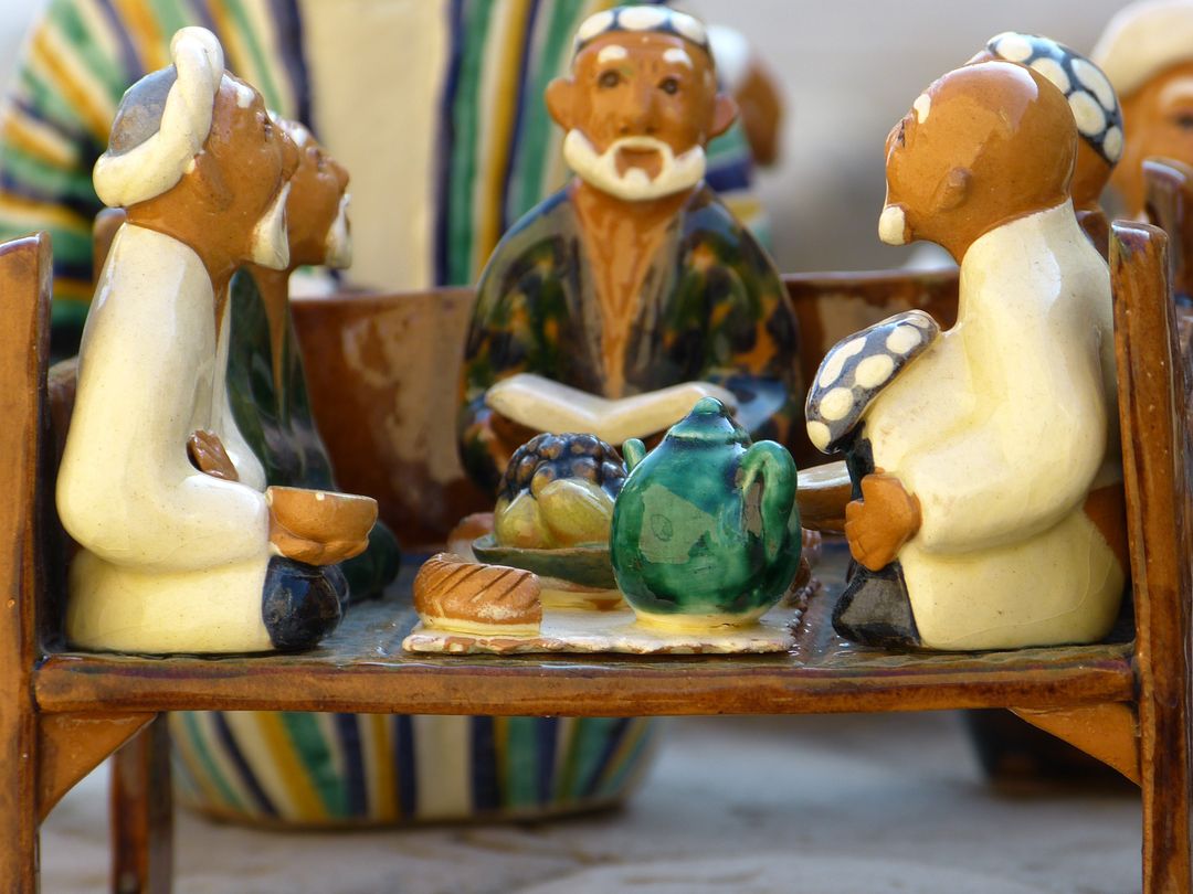 Clay Figurines Depict Traditional Gathering With Tea and Bread - Free Images, Stock Photos and Pictures on Pikwizard.com