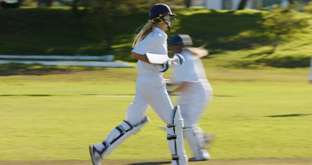 Female Cricketer Running Between Wickets During Exciting Match