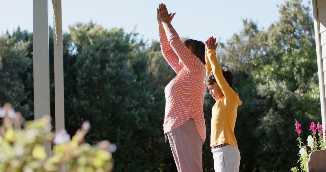 Grandmother and Grandson Practicing Yoga Outdoors Together - Free Images, Stock Photos and Pictures on Pikwizard.com