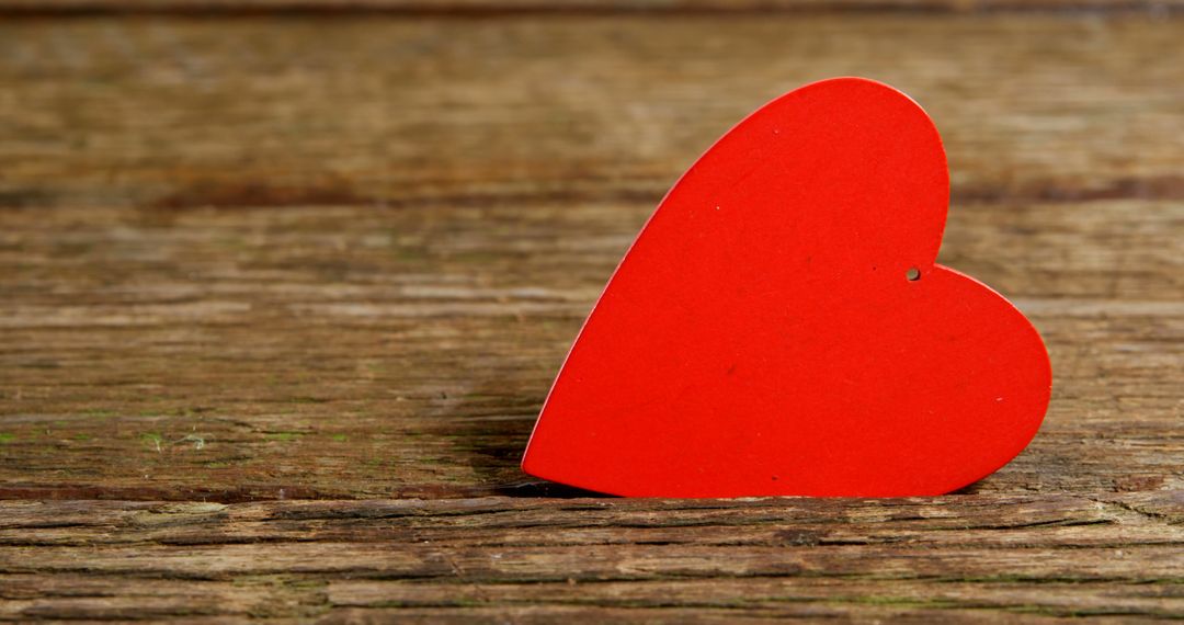 Red Wooden Heart on Rustic Wooden Surface for Romantic Themes - Free Images, Stock Photos and Pictures on Pikwizard.com