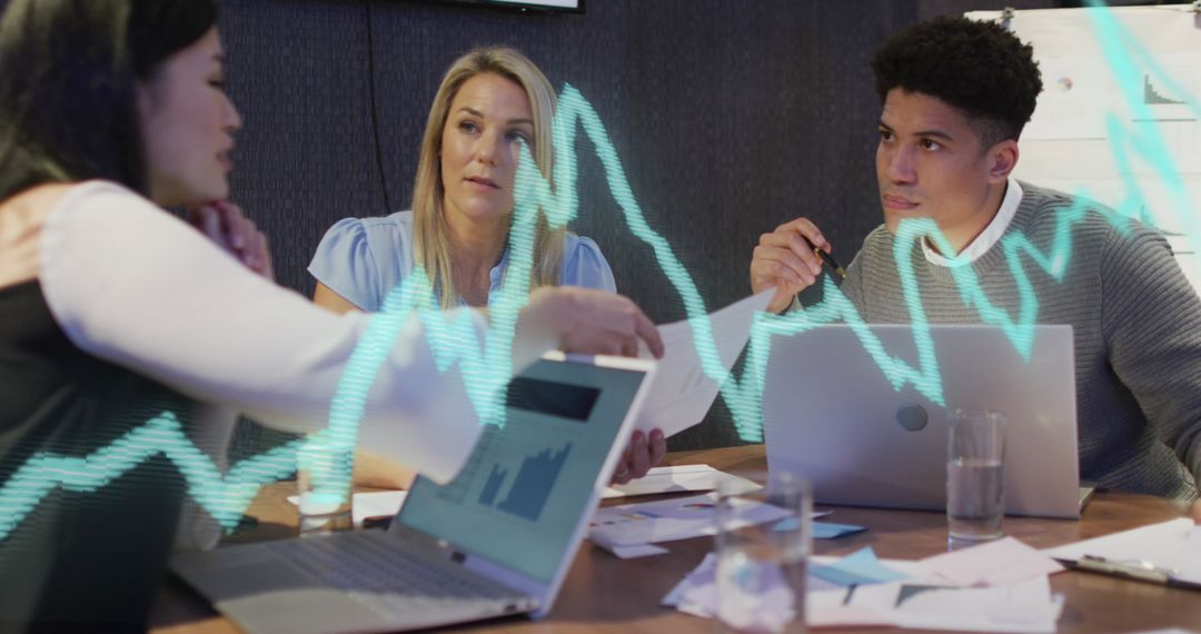 Business Team Analyzing Data with Digital Graph Overlay