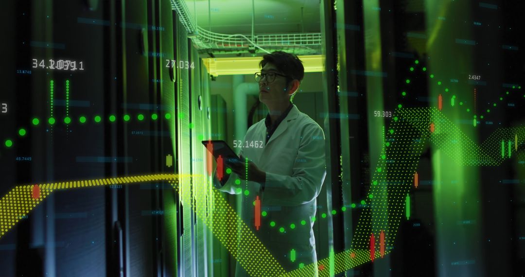 Asian IT Technician Analyzing Financial Data in Server Room