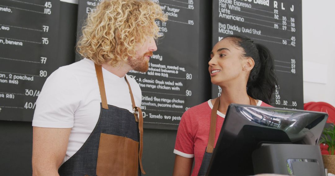 Cheerful Baristas Working in Modern Café