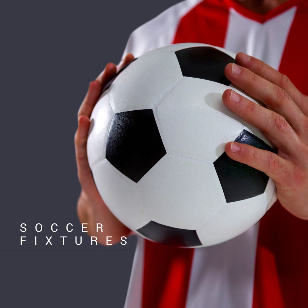 Soccer Player Holding Ball in Red and White Jersey