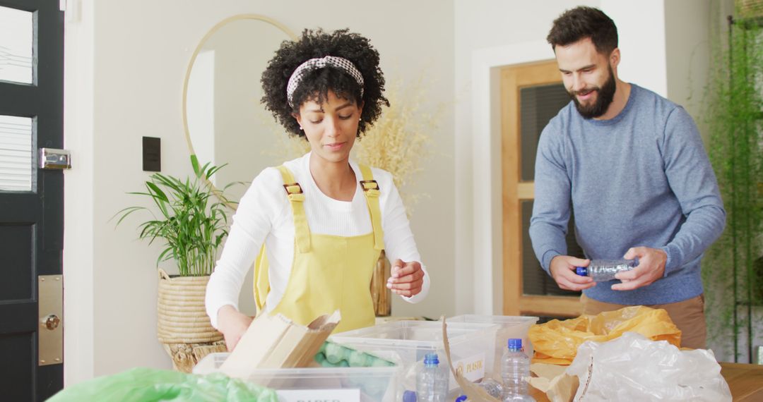 Happy Couple Sorting Recycling Together at Home