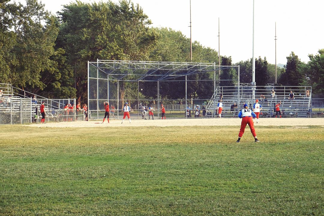 Youth Baseball Team Competing on Field During Summer Day - Free Images, Stock Photos and Pictures on Pikwizard.com