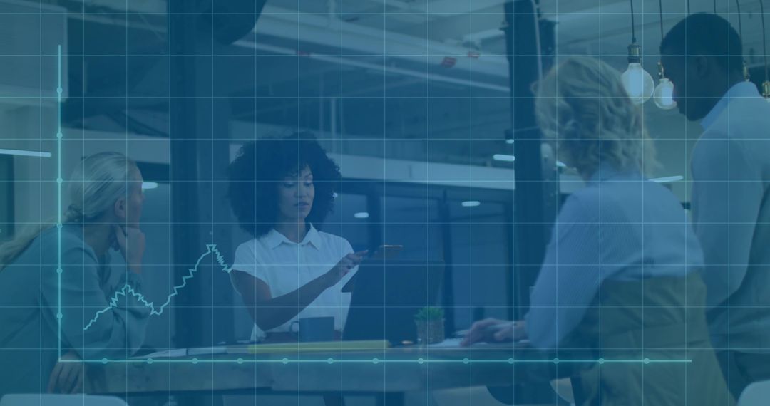 Business Team Analyzing Data on Laptop in Modern Office Setting