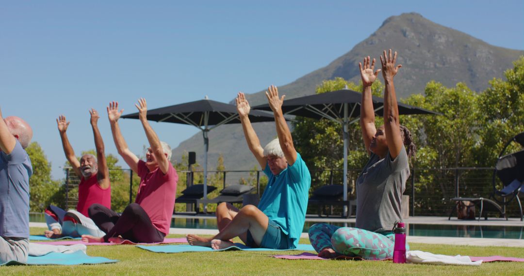 Group of Seniors Participating in Outdoor Yoga Class With Mountain View - Free Images, Stock Photos and Pictures on Pikwizard.com