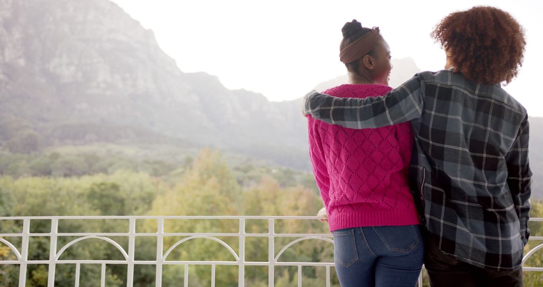 Couple Embracing on Scenic Balcony with Mountain View - Free Images, Stock Photos and Pictures on Pikwizard.com