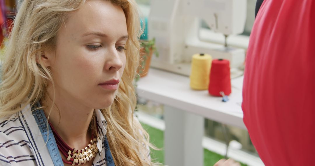 Female Fashion Designer Concentrating in Studio with Colorful Thread - Free Images, Stock Photos and Pictures on Pikwizard.com