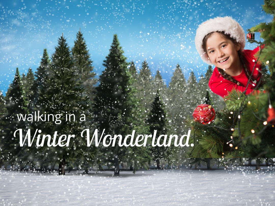 Joyful Child Decorating Christmas Tree in Snowy Forest