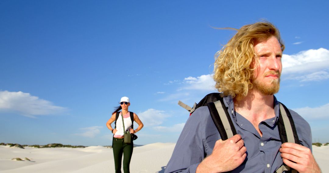 Couple Hiking in Desert Landscape with Clear Blue Sky - Free Images, Stock Photos and Pictures on Pikwizard.com