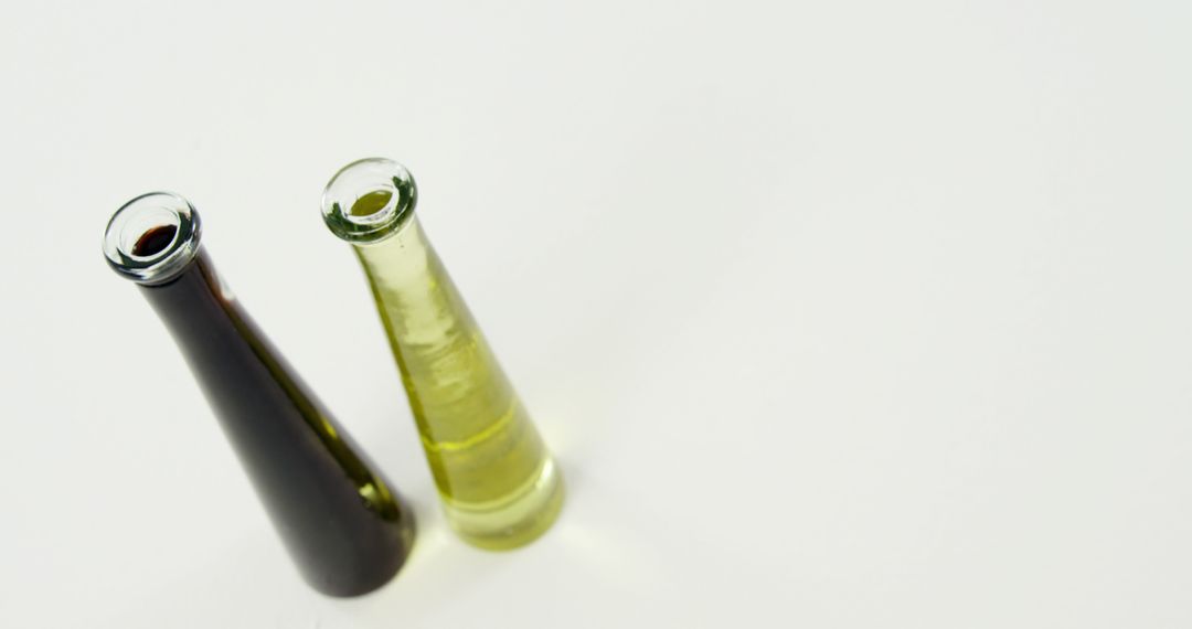 Two Glass Bottles with Olive Oil and Vinegar on White Background - Free Images, Stock Photos and Pictures on Pikwizard.com