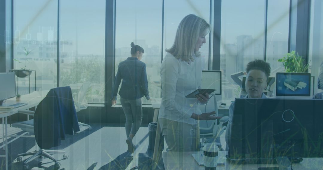 Diverse Team Collaborating on Data in Modern Office Environment