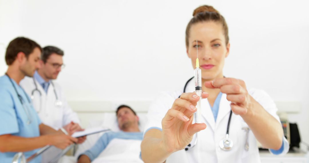 Nurse Preparing Injection with Patients and Doctors in Background - Free Images, Stock Photos and Pictures on Pikwizard.com