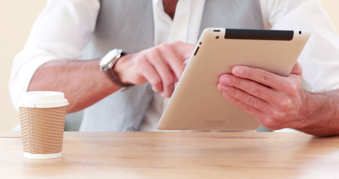 Businessman Using Tablet and Checking Time in Casual Setting
