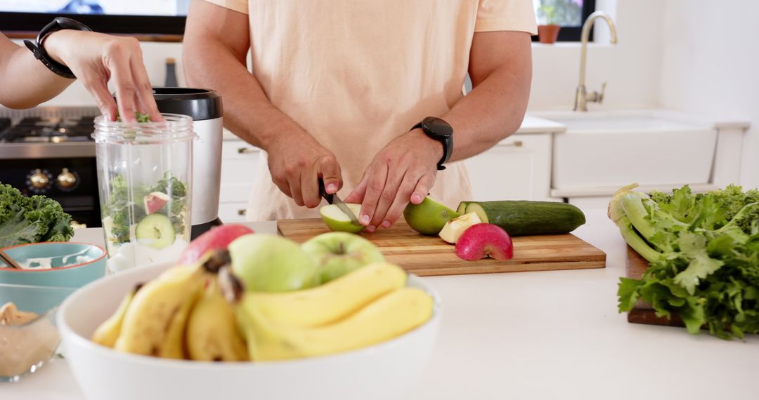 Couple Making Healthy Green Smoothie in Bright Kitchen