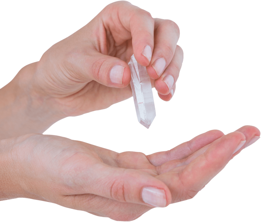 Hands Holding Transparent Quartz Crystal on White Background