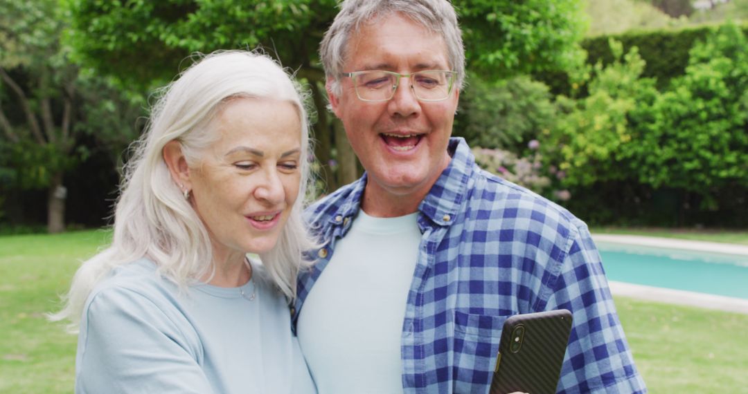 Image of caucasian senior couple embracing in garden, taking selfie - Free Images, Stock Photos and Pictures on Pikwizard.com