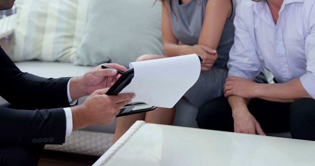 Agent Discussing Contract with Business Couple