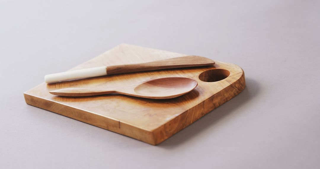 Wooden Cutting Board with Spoon and Knife on Gray Background - Free Images, Stock Photos and Pictures on Pikwizard.com