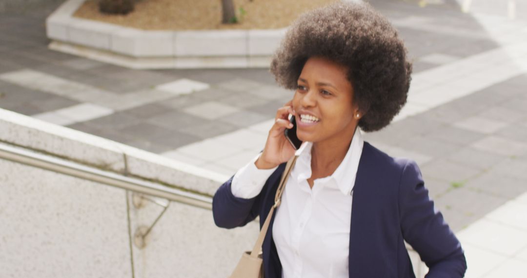 Confident Businesswoman Talking on Smartphone in Urban Environment