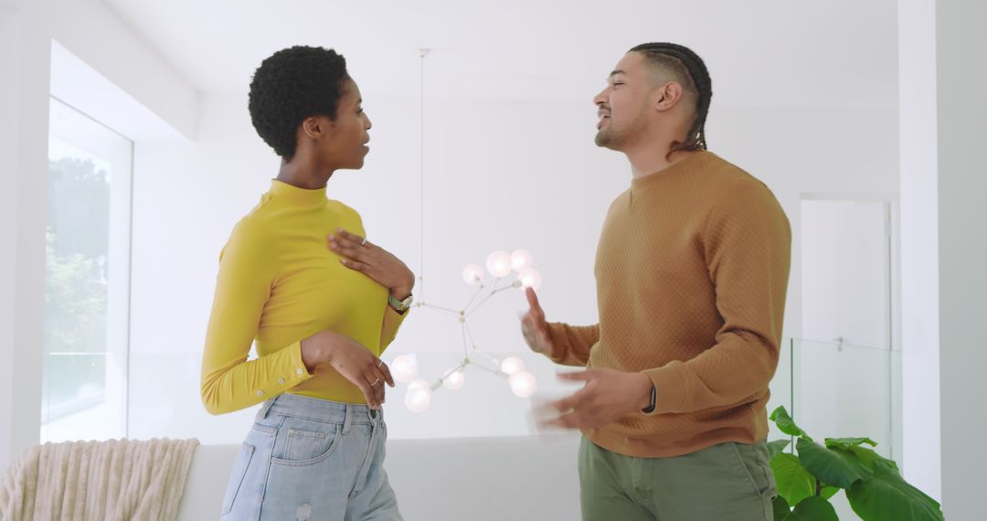 Couple in Modern Home Discussing Near Large Window