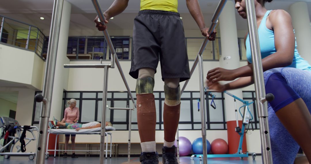 Person with Prosthetic Legs Undergoing Rehabilitation Therapy Session - Free Images, Stock Photos and Pictures on Pikwizard.com