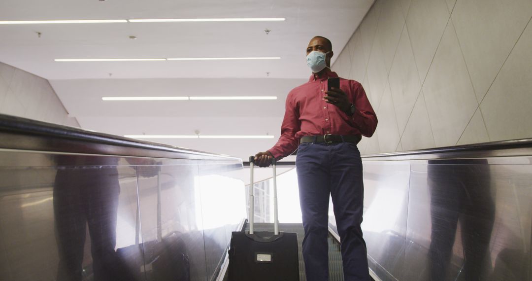 Businessman with Suitcase Using Escalator in Airport - Free Images, Stock Photos and Pictures on Pikwizard.com