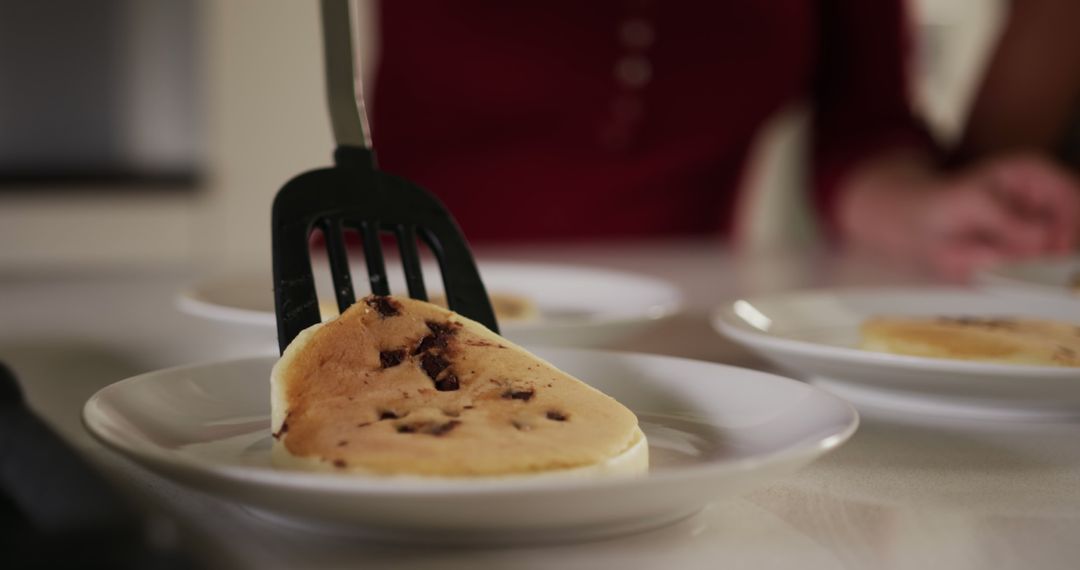 Close-up of Freshly Cooked Pancakes on Plates in Cozy Kitchen - Free Images, Stock Photos and Pictures on Pikwizard.com