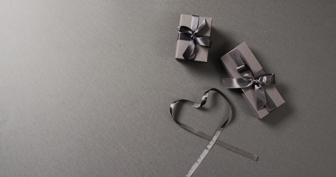 Elegant Black Gift Boxes With Ribbons On Grey Background - Free Images, Stock Photos and Pictures on Pikwizard.com