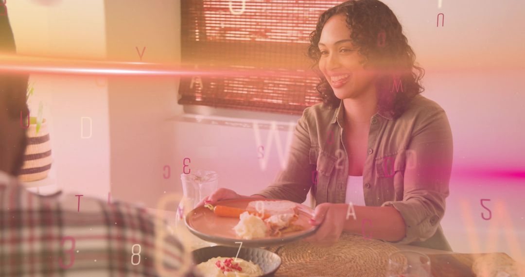 Smiling woman offering breakfast sandwich to partner at sunlit table with warm overlay