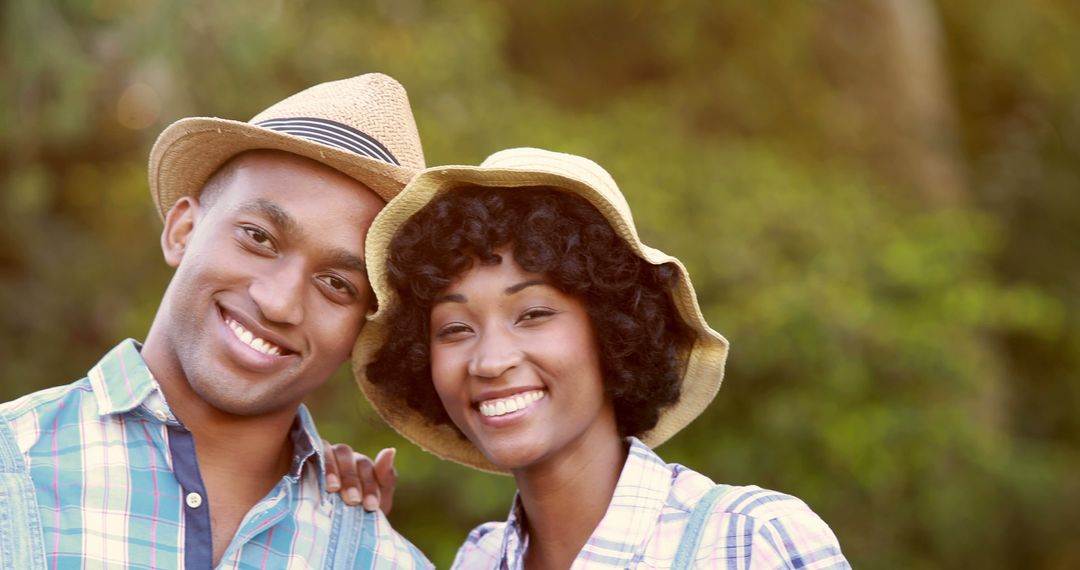 Happy Couple in Hats Enjoying Nature - Free Images, Stock Photos and Pictures on Pikwizard.com