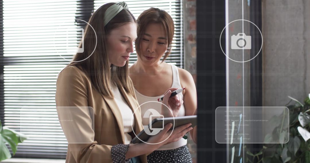 Diverse Businesswomen Collaborating on Digital Technology