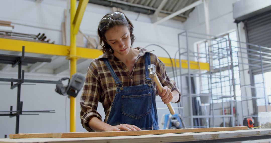 Young Woman Focused on Skilled Woodworking in Workshop - Free Images, Stock Photos and Pictures on Pikwizard.com